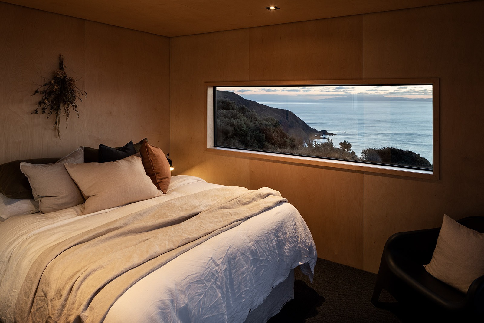 Pipinui Point accomidation master bedroom, with veiws down to the ocean from the window